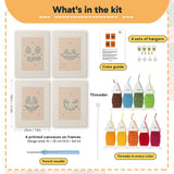 What is in the Pumpkin Grins set, 8 × 12 in (20 × 30 cm) each: 4 printed canvases, punch needle, threader, threads, color guide and 4 sets of hangers
