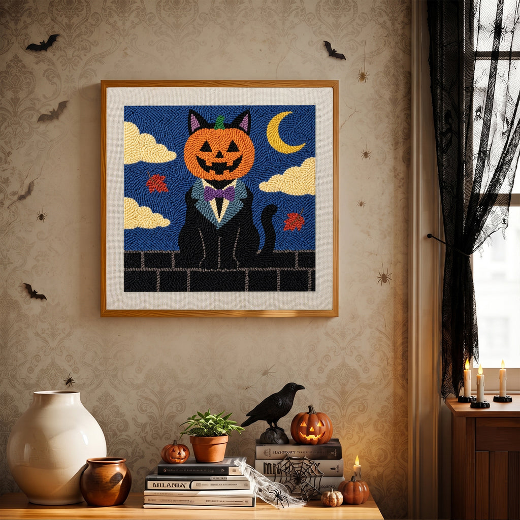 Finished Pumpkin Head Cat punch needle canvas on a wall