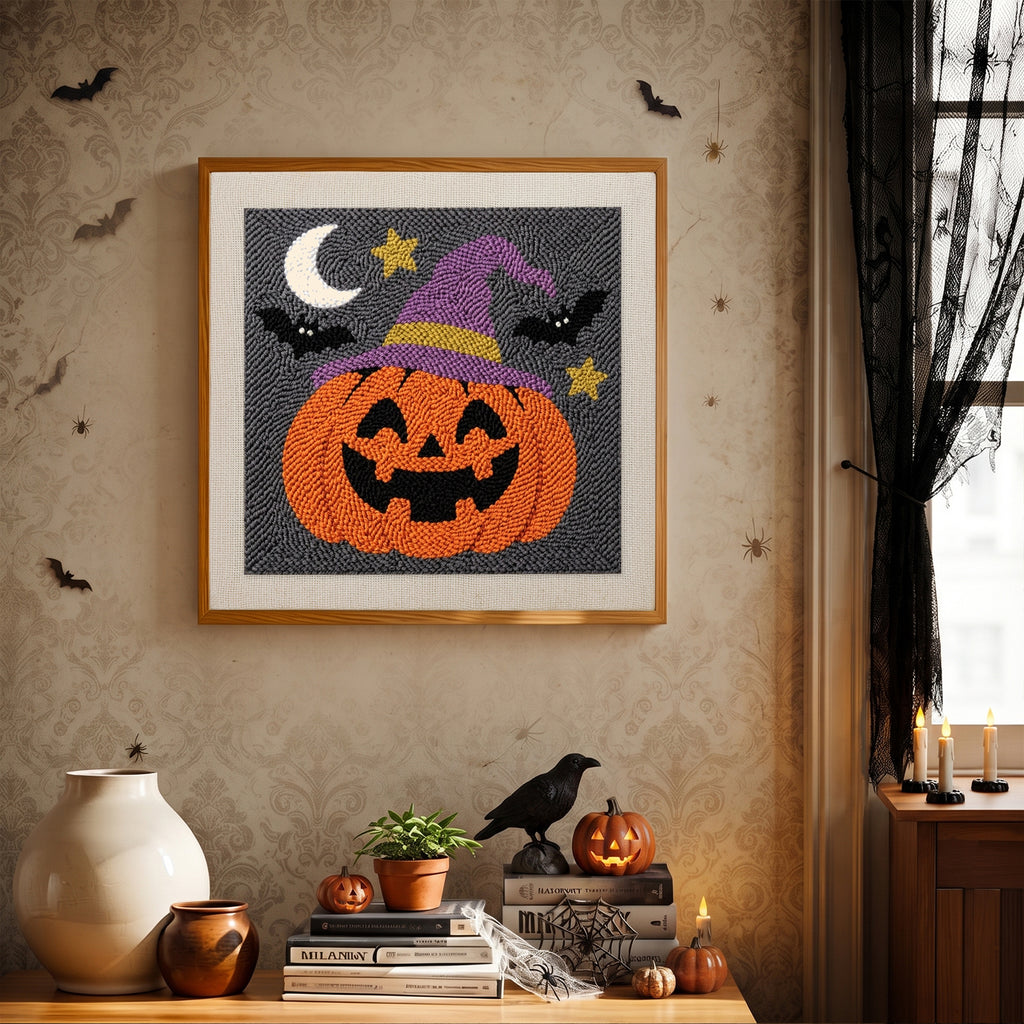 Finished Pumpkin in a Purple Hat punch needle canvas on a wall