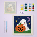 Pumpkin Patch Ghost canvas before and after punching, with the threads and tools
