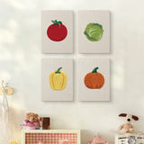The four Pumpkin Pepper Patch mini canvases on a wall above a shelf
