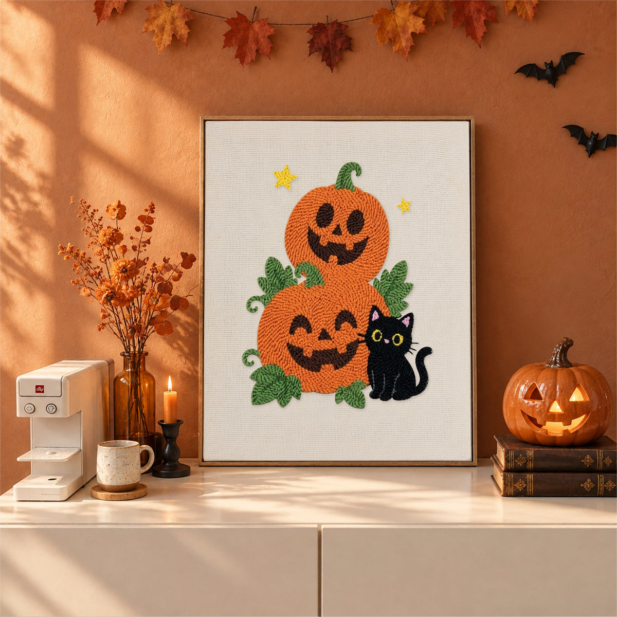 Finished Pumpkin Stack and Cat punch needle canvas on a wall