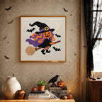 Finished Pumpkin Witch in Flight punch needle canvas on a wall