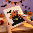 Punching the Pumpkins in a Witch Boot design with the punch needle