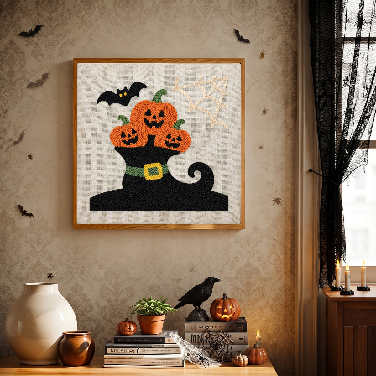 Finished Pumpkins in a Witch Boot punch needle canvas on a wall