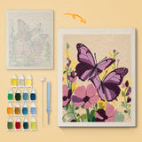 Purple Butterflies canvas before and after punching, with the threads and tools