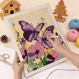 Punching the Purple Butterflies design with the punch needle