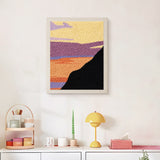 Finished Purple Cliff Sunset punch needle canvas on a wall