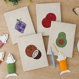 The four finished Purple Grape Bunch mini canvases laid out on a table