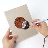 Punching a Purple Grape Bunch mini canvas with the punch needle