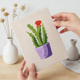Hand holding a finished Purple Pot Cacti mini canvas