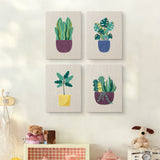 The four Purple Pot Plants mini canvases on a wall above a shelf