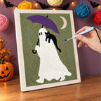 Punching the Purple Umbrella Ghost design with the punch needle