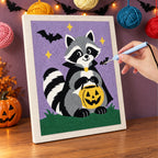 Punching the Raccoon Trick-or-Treater design with the punch needle