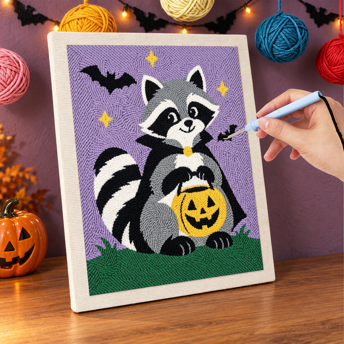 Punching the Raccoon Trick-or-Treater design with the punch needle