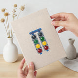 Hand holding a finished Race Day Flag mini canvas