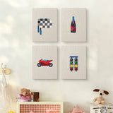 The four Race Day Flag mini canvases on a wall above a shelf