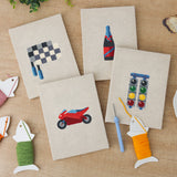 The four finished Race Day Flag mini canvases laid out on a table