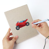 Punching a Race Day Flag mini canvas with the punch needle