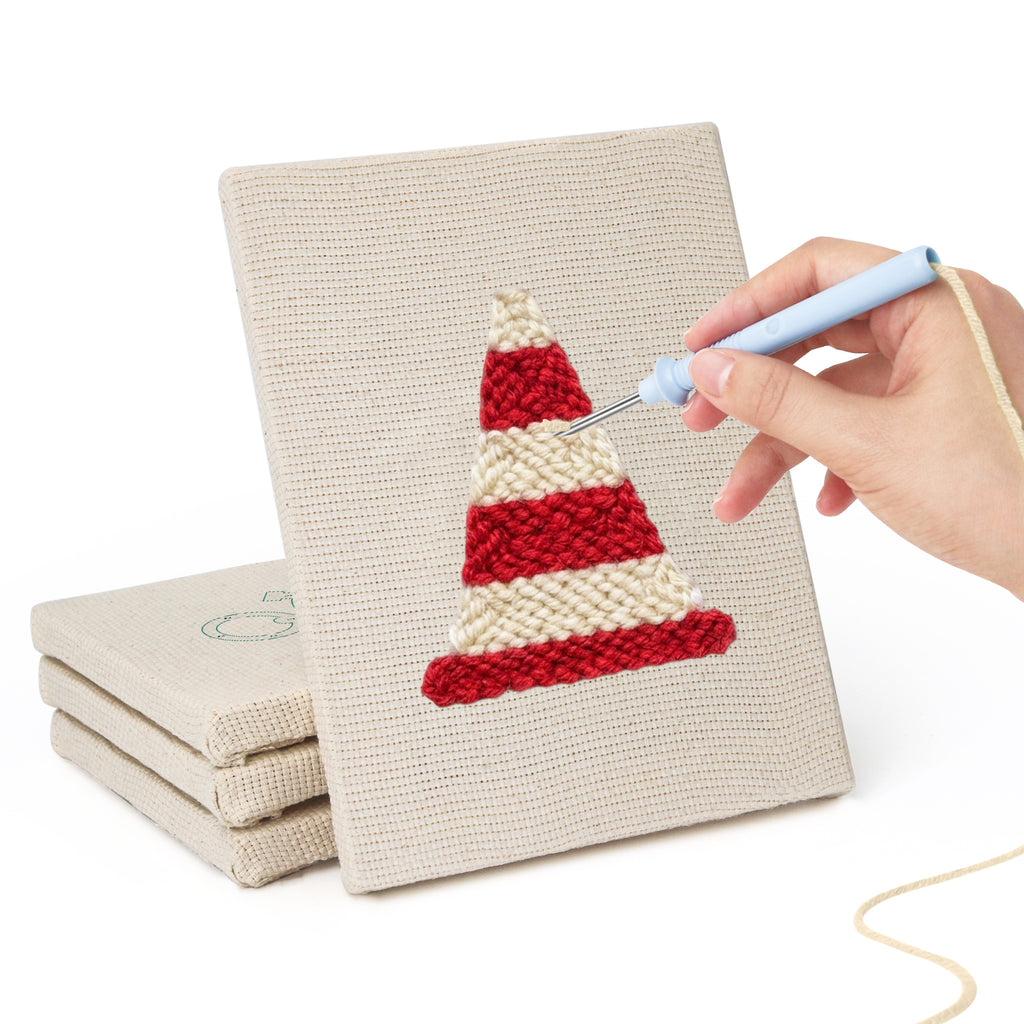 Hand punching one of the Race Day Gear mini canvases