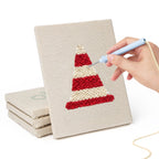 Hand punching one of the Race Day Gear mini canvases