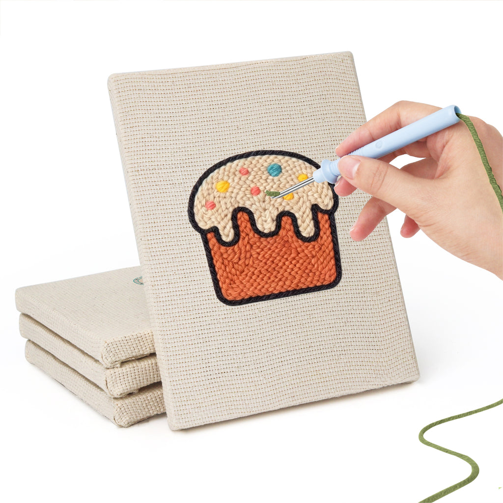 Hand punching one of the Rainbow and Butterfly mini canvases