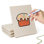 Hand punching one of the Rainbow and Butterfly mini canvases
