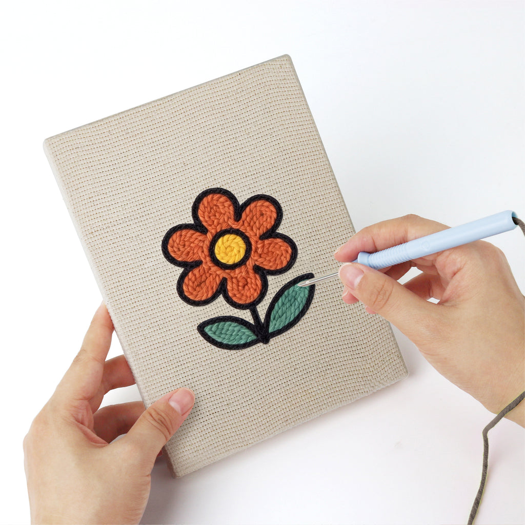 Punching a Rainbow and Butterfly mini canvas with the punch needle