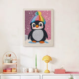 Finished Rainbow Beanie Penguin punch needle canvas on a wall