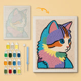 Rainbow Patchwork Cat canvas before and after punching, with the threads and tools