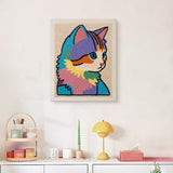 Finished Rainbow Patchwork Cat punch needle canvas on a wall
