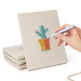 Hand punching one of the Rainbow Pot Cacti mini canvases