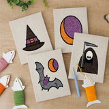 The four finished Reaper and Bat mini canvases laid out on a table