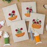 The four finished Red Bloom Bowls mini canvases laid out on a table