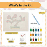 What is in the Red Blossom Bonsai kit: printed canvas, punch needle, threader, threads, color guide and hangers