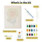 What is in the Red Center Sunflower kit: printed canvas, punch needle, threader, threads, color guide and hangers