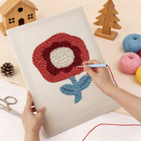 Punching the Red Poppy design with the punch needle
