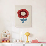 Finished Red Poppy punch needle canvas on a wall