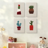 The four Red Pot Cacti mini canvases on a wall above a shelf
