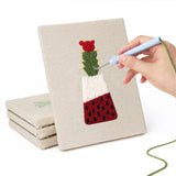 Hand punching one of the Red Pot Cacti mini canvases