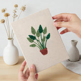 Hand holding a finished Red Pot Palms mini canvas