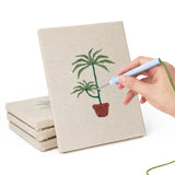 Hand punching one of the Red Pot Palms mini canvases