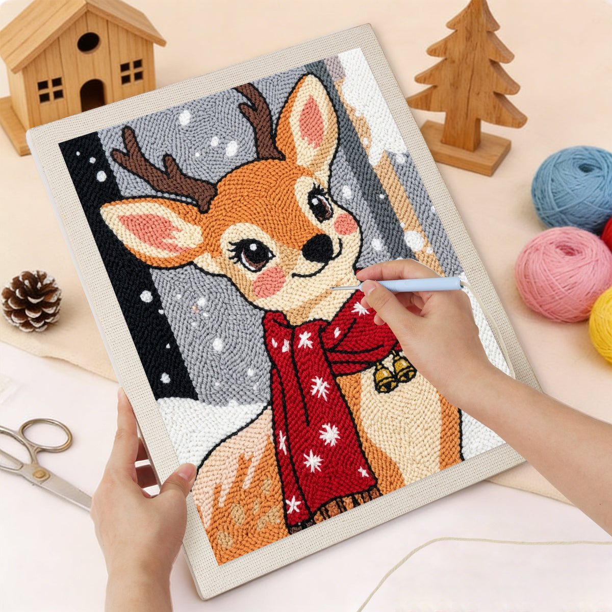 Punching the Red Scarf Fawn design with the punch needle