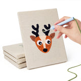 Hand punching one of the Reindeer and Cow mini canvases