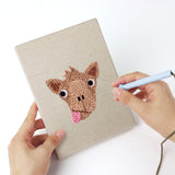 Punching a Reindeer and Cow mini canvas with the punch needle