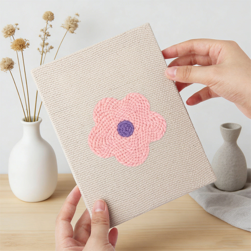 Hand holding a finished Retro Flower Heads mini canvas