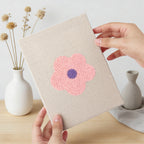 Hand holding a finished Retro Flower Heads mini canvas