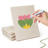 Hand punching one of the Retro Flower Shapes mini canvases