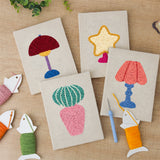 The four finished Retro Table Lamps mini canvases laid out on a table