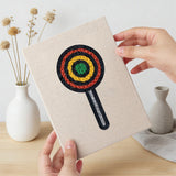 Hand holding a finished Robot and Lollipop mini canvas